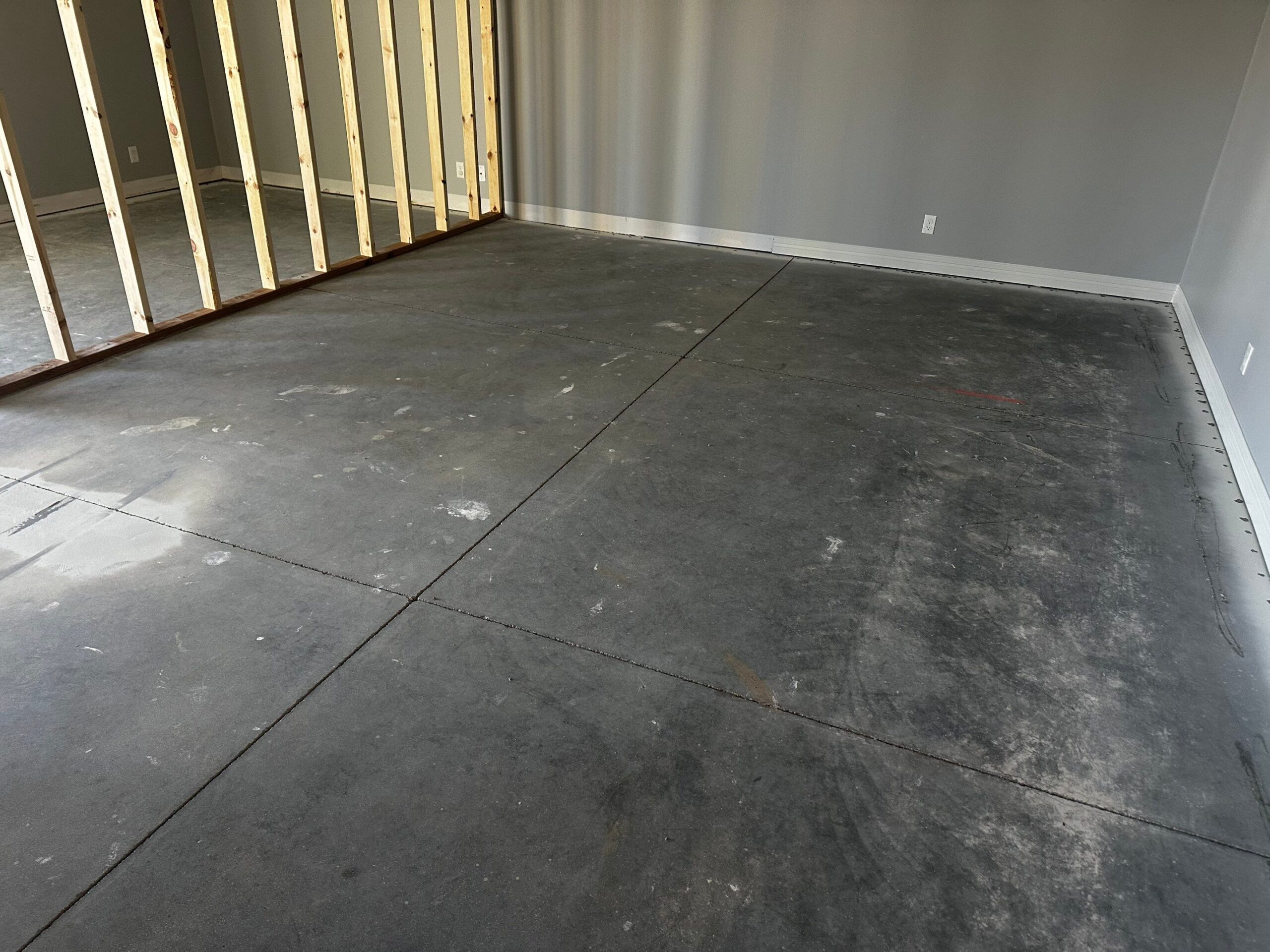 Concrete floor before grind and clear