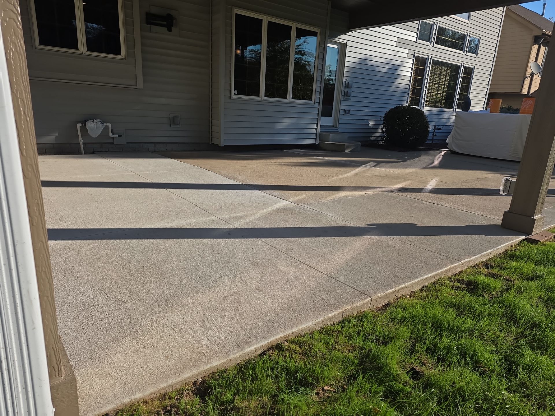 Patio with mismatched concrete pours before coating